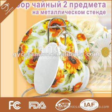 2 pcs porcelain tea set: 1 cup and 1 saucer with metal stand in color box